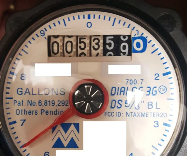 Water Meter showing household water usage and meter dials used to track daily water consumption
